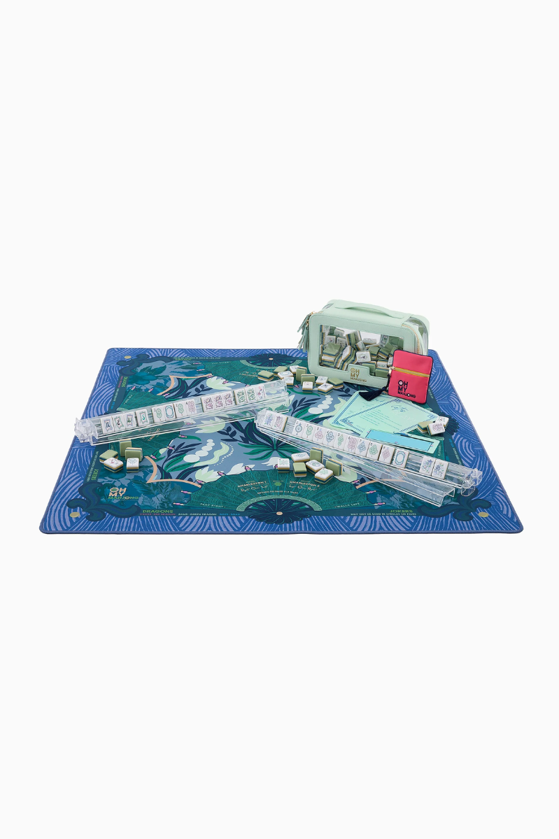 Board game set with a blue mat, dice, and game pieces on a white background