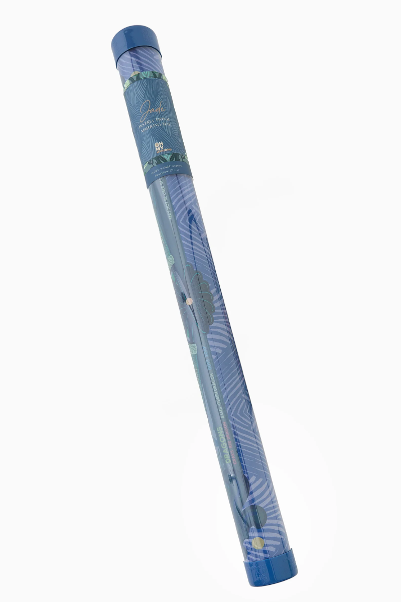 Blue cylindrical product with decorative patterns on a white background