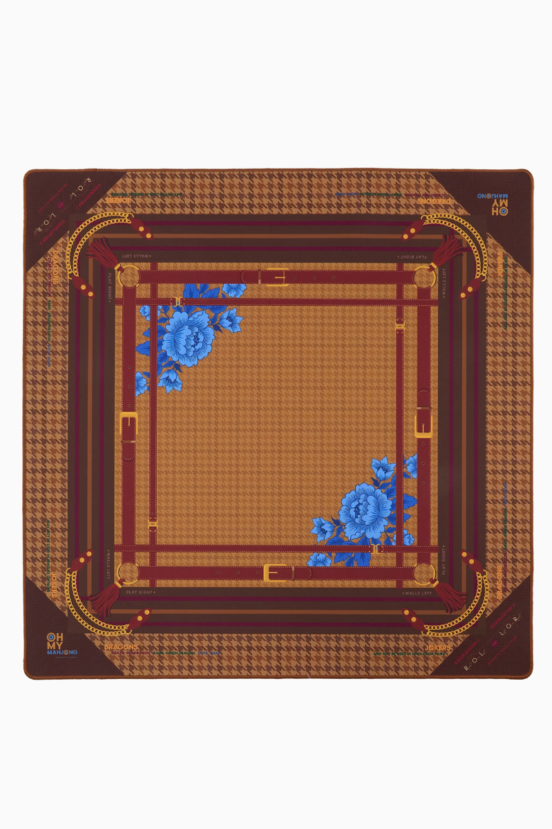 Decorative Mahjong mat with floral patterns, houndstooth and gold accents on a white background. Palomino Mat in Tube | Oh My Mahjong