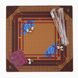 Mahjong game setup with dice and components on a brown and gold board