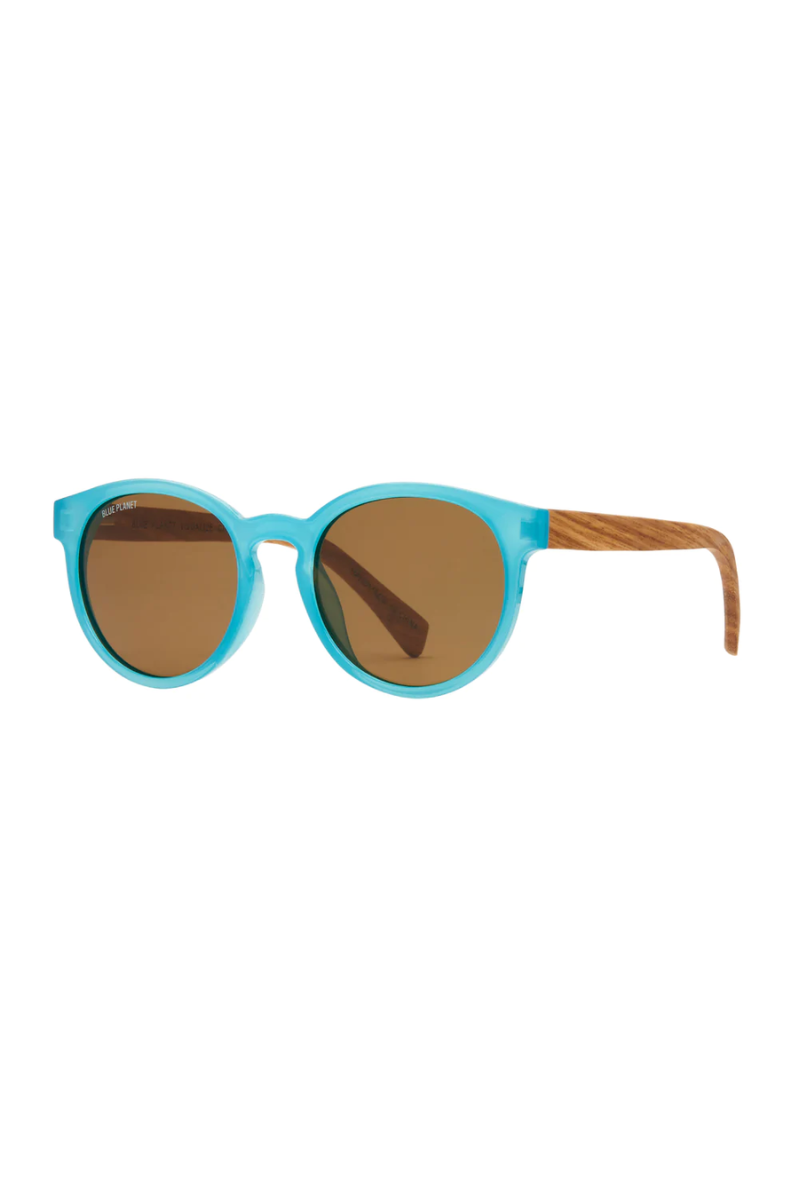 Sunglasses with turquoise frame and brown lenses on a white background