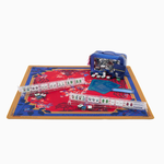 Board game set with colorful mat, dice, and pieces on a white background | Scarlett Mat in Tube | Oh My Mahjong