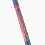 Colorful cylindrical object with a pattern on a white background