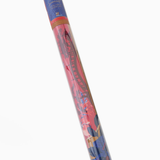 Colorful cylindrical object with a pattern on a white background