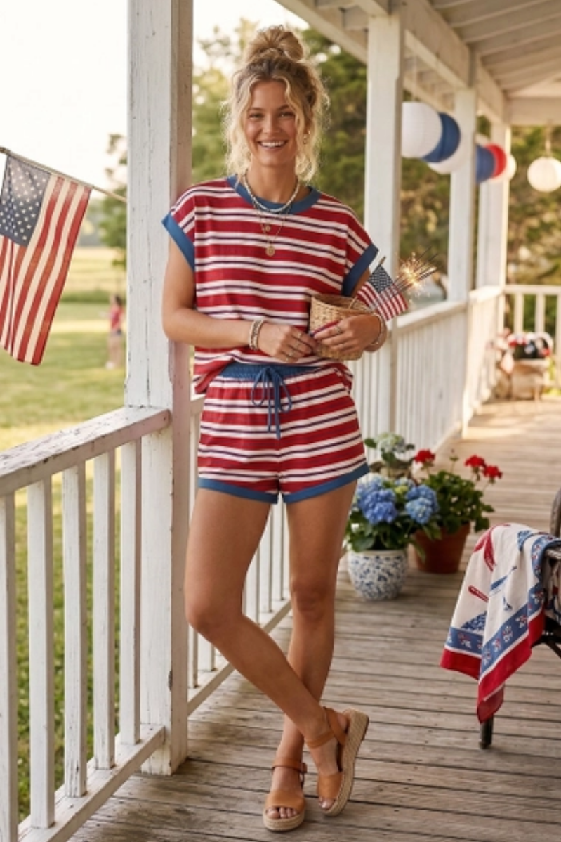 Woman standing on porch wearing Americana Striped Relaxed Fit Top with matching bottoms. 