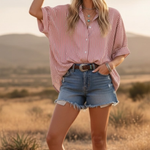 Woman standing in western town. Yee-haw! Featuring an Oversized Short Sleeve Button Down Shirt