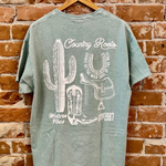 Spirit of the Wild Mineral Washed Graphic Tee against brick wall