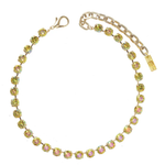 Gold necklace with colorful stones on a white background