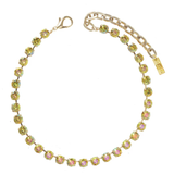 Gold necklace with colorful stones on a white background