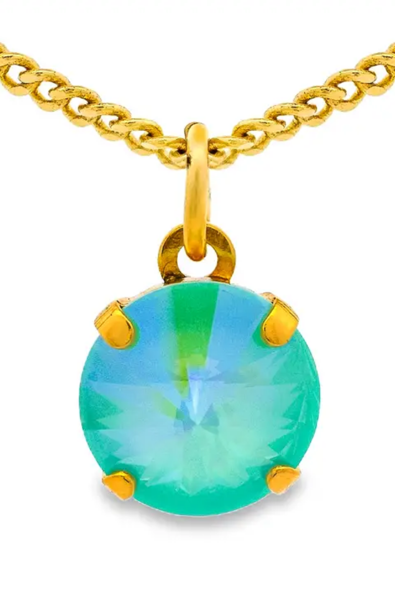 Gold necklace with a green gemstone pendant on a white background. Talia Necklace in Candy Crush| TOVA