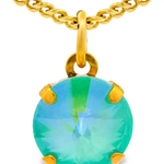 Gold necklace with a green gemstone pendant on a white background. Talia Necklace in Candy Crush| TOVA