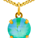 Gold necklace with a green gemstone pendant on a white background. Talia Necklace in Candy Crush| TOVA