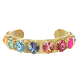 Gold bracelet with colorful gemstones on a white background