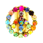 Multicolored jeweled peace sign on a white background