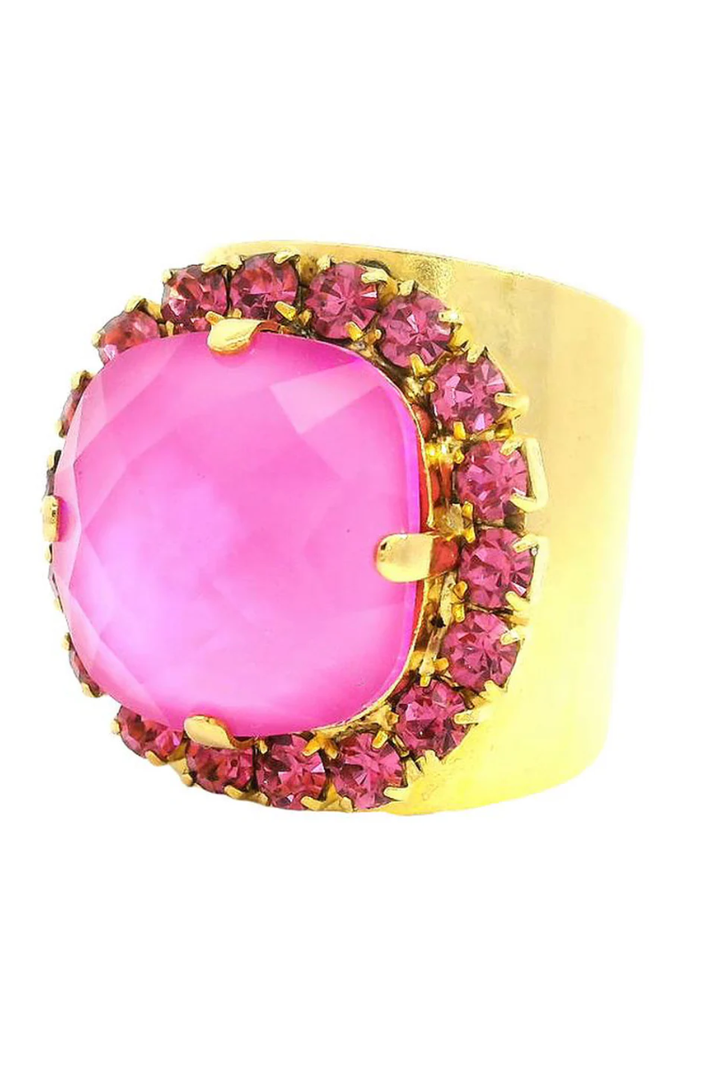 Gold ring with a pink gemstone on a white background