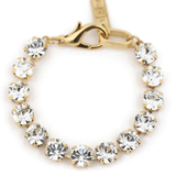 Gold bracelet with clear gemstones on a white background