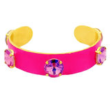 Pink bracelet with yellow accents and colorful gemstones on a white background