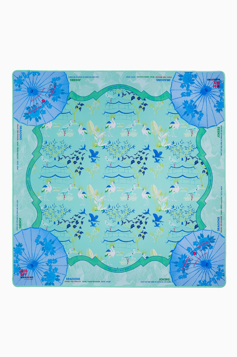 Decorative game/tile mat with floral and wave design on a white background. Veranda Mat in Tube | Oh My Mahjong