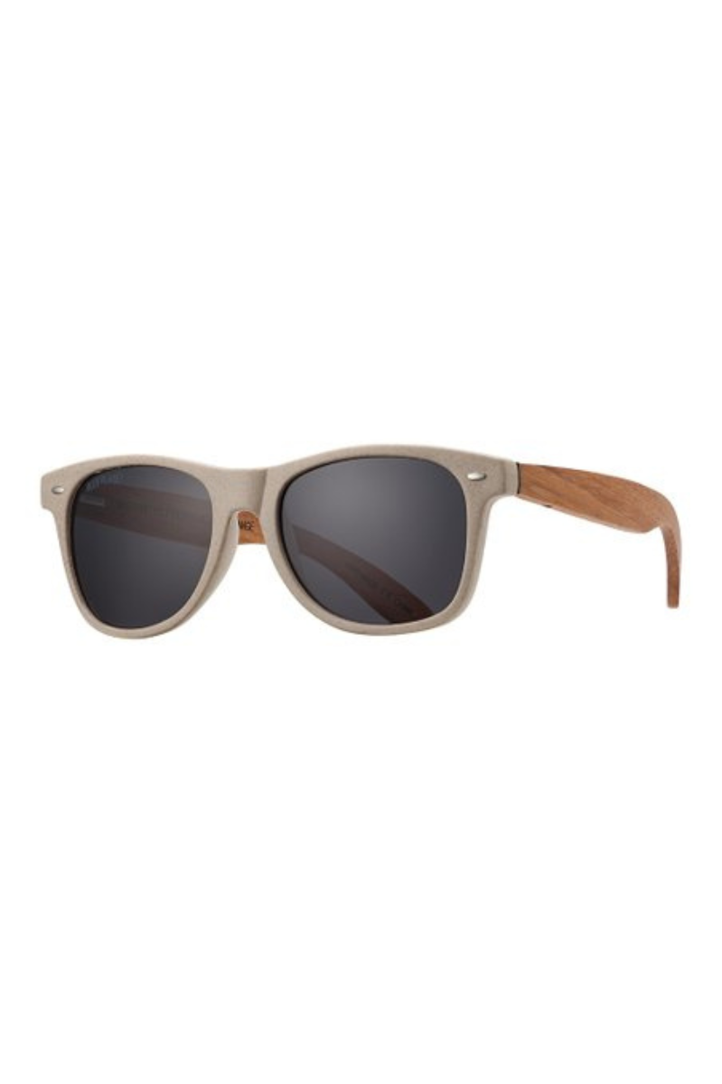 Sunglasses with wooden frame and dark lenses on a white background