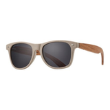 Sunglasses with wooden frame and dark lenses on a white background