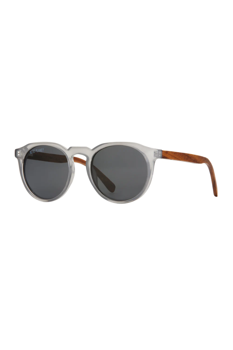 Sunglasses with round lenses and wooden arms on a white background