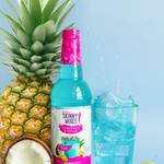 Bottle of Sunny Mixes Caipirinha Mix with a pineapple, coconut, and blue cocktail on a light blue background