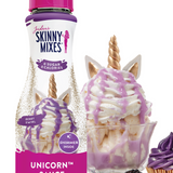 Skinny Mixes Unicorn sauce bottle with dessert items on a white background