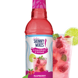 Skinny Mixes raspberry syrup bottle with a glass of raspberry juice on a white background