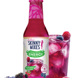 Skinny Mixes Wild Berry drink mix bottle with a glass of mixed berry drink and berries on a white background