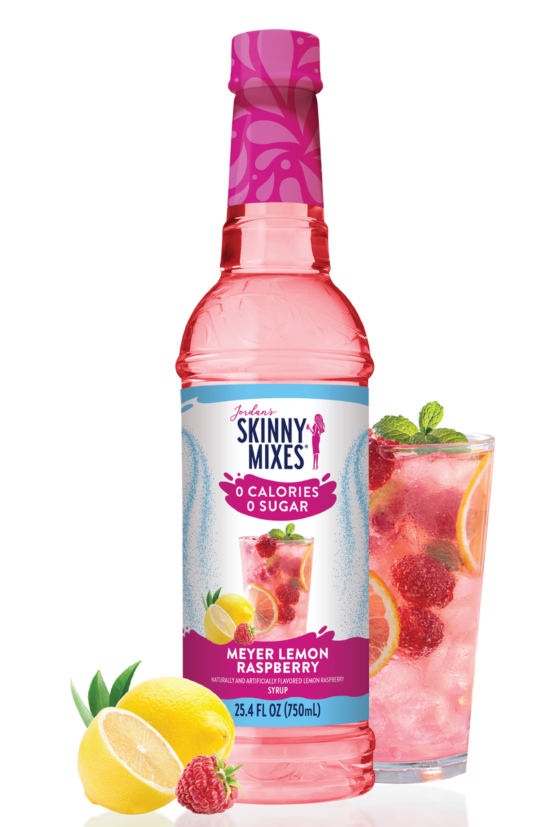 Skinny Mixes Meyer Lemon Raspberry syrup bottle with a glass of lemonade and fruit on a white background