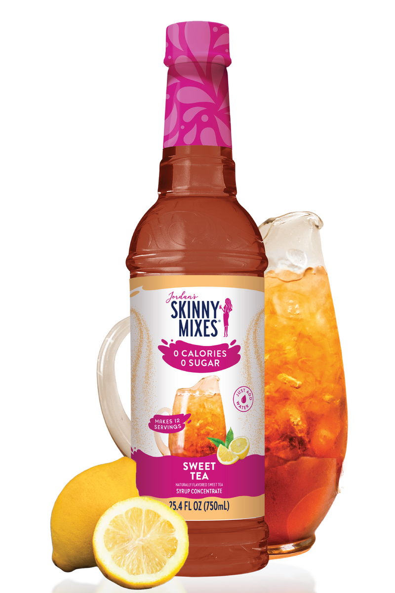 Skinny Mixes Sweet Tea bottle with a pitcher of tea and lemons on a white background