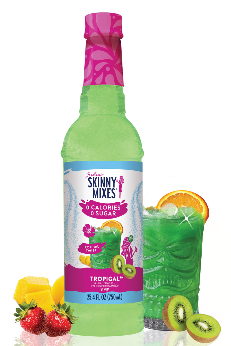 Green bottle of Skinny Mixes Tropical flavor with fruit slices on a white background