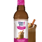 Bottle of Skinny Mixes Brown Sugar Cinnamon syrup with a glass of coffee and cinnamon sticks on a white background