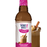 Bottle of Skinny Mixes Brown Sugar Cinnamon syrup with a glass of coffee and cinnamon sticks on a white background