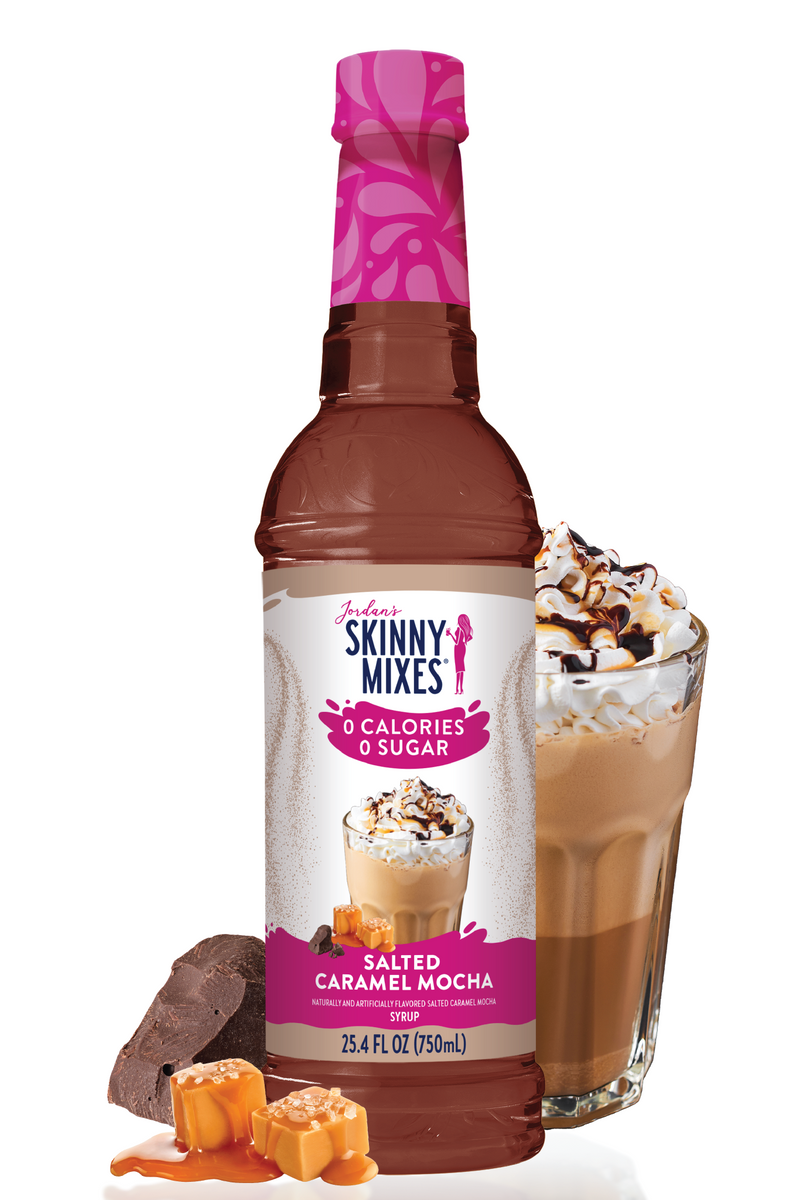 Bottle of Skinny Mixes Salted Caramel Mocha syrup with a glass of coffee and toppings on a white background