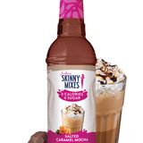 Bottle of Skinny Mixes Salted Caramel Mocha syrup with a glass of coffee and toppings on a white background