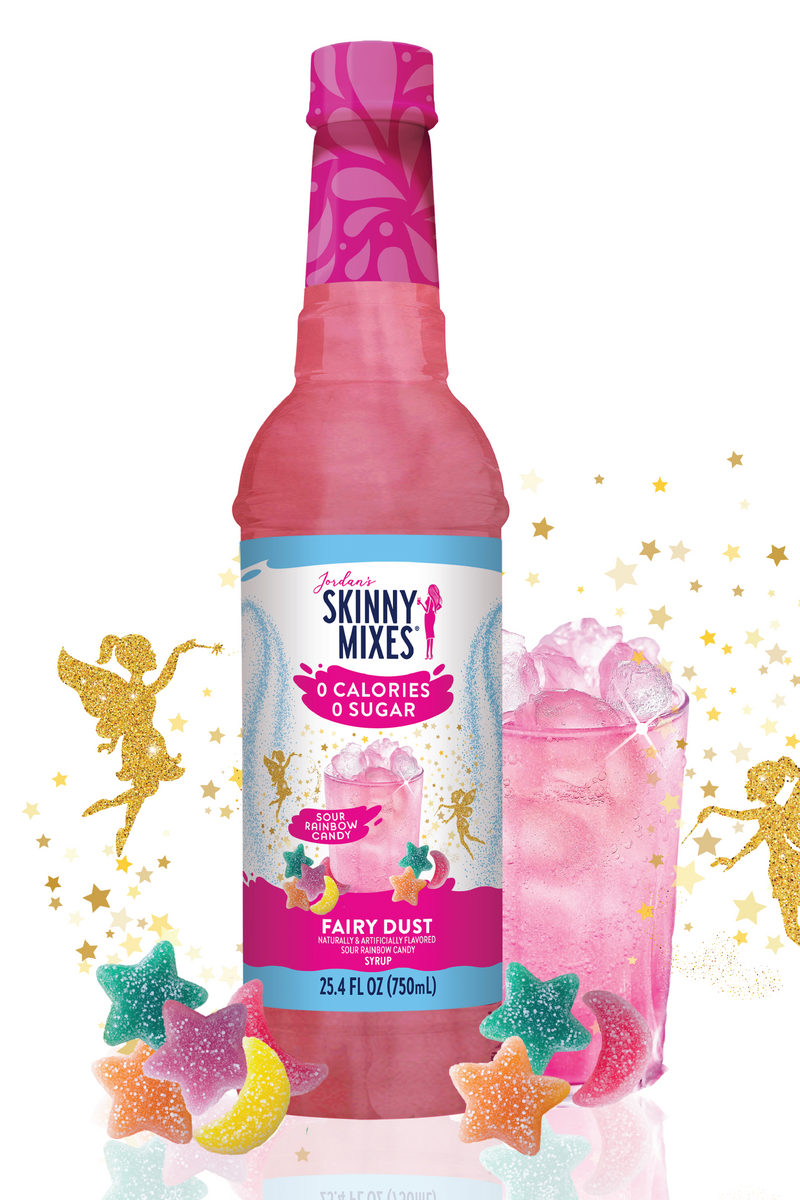 Pink bottle of Skinny Mixes Fairy Dust syrup with decorative elements on a white background